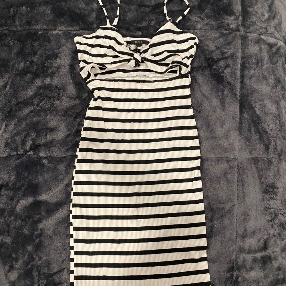 Striped maxi dress, has a small opening mid stomach area
